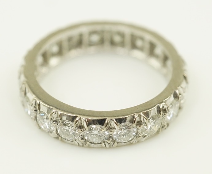 A platinum? and nineteen stone illusion set diamond full eternity ring